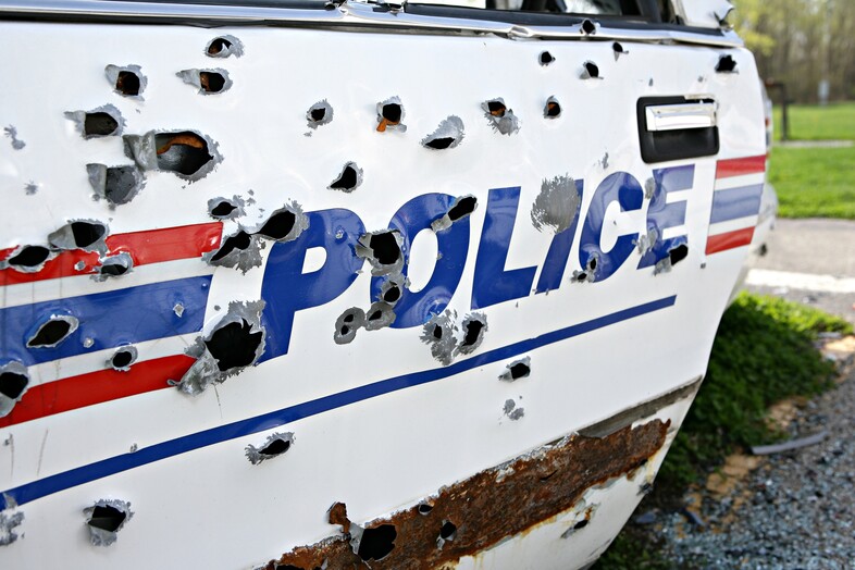 A police car with bullet holes