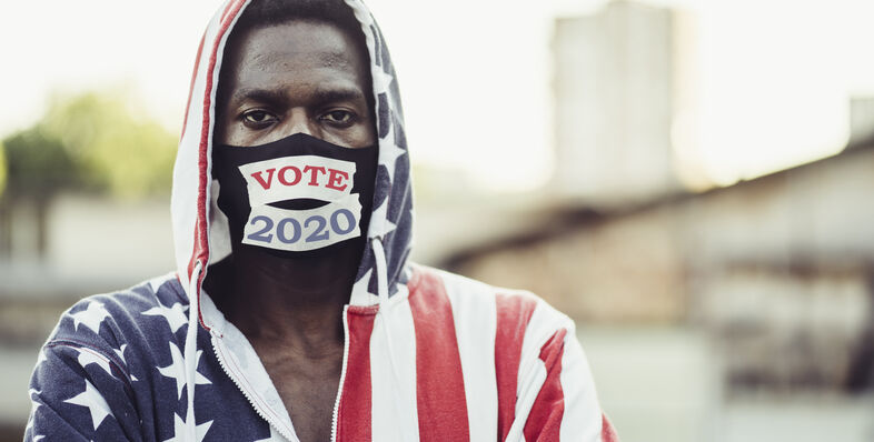 Man wearing American flag with vote mask