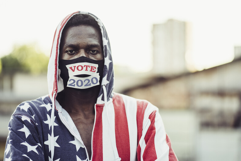 Man wearing American flag with vote mask