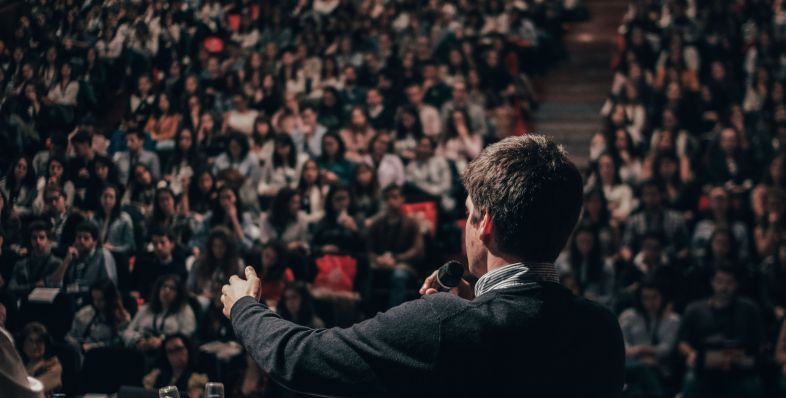 Presidential candidate speaking in front of a crowd