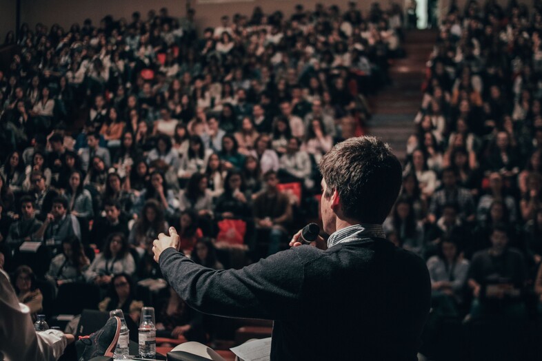 Presidential candidate speaking in front of a crowd