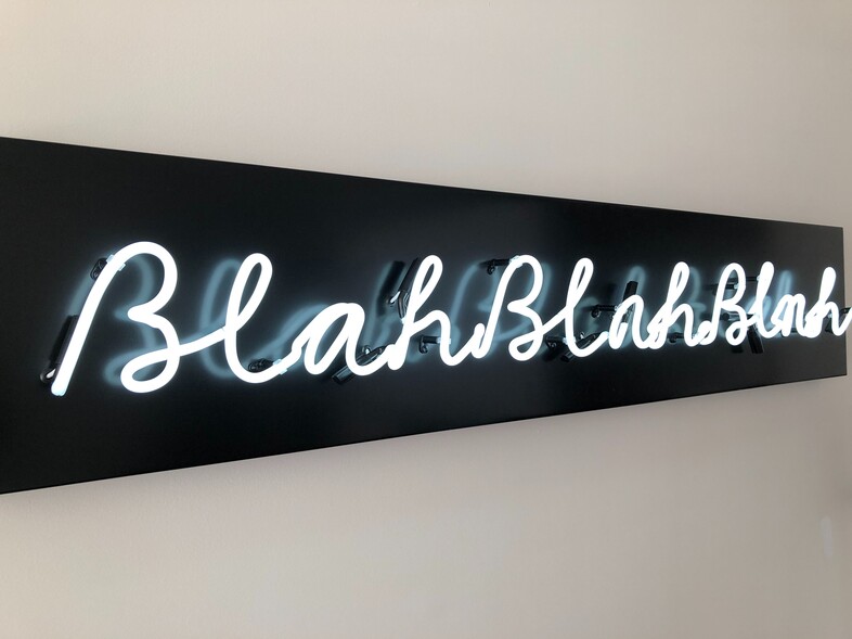 Neon sign with the words blah, blah, blah