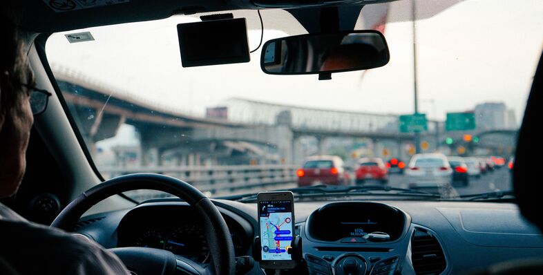 A photo from the backseat of an Uber