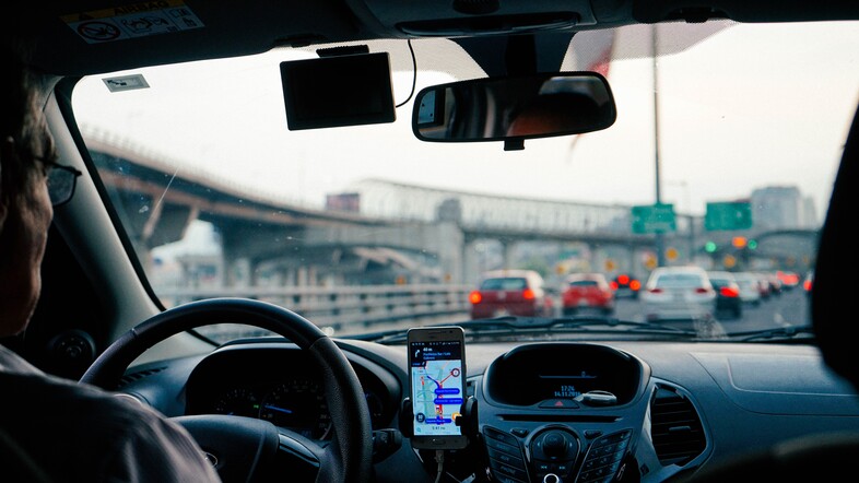 A photo from the backseat of an Uber