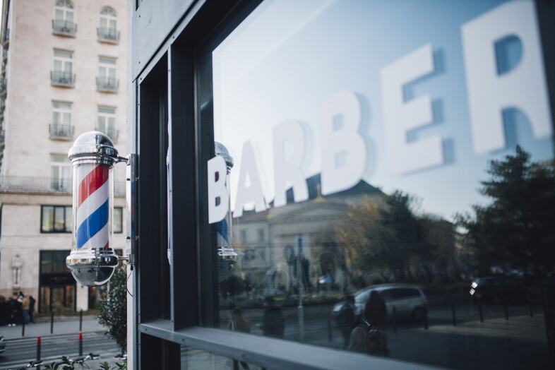 A photo of a barbershop window