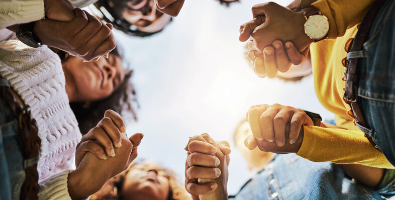 A group of people holding hands