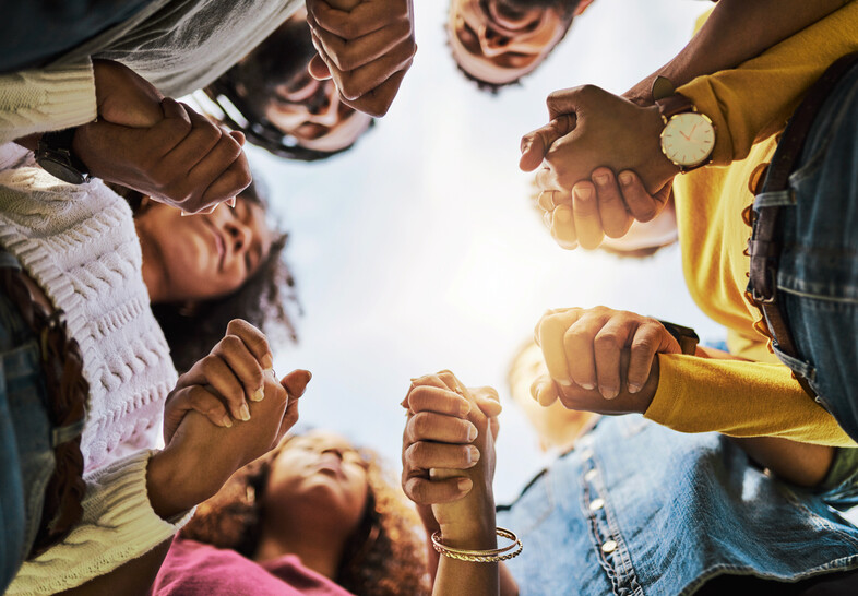 A group of people holding hands