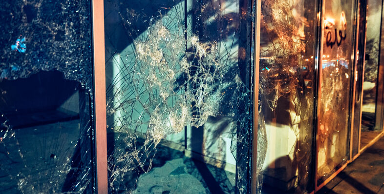 A photo of shattered window panes