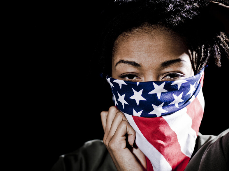 An African American woman wearing an American Flag bandana