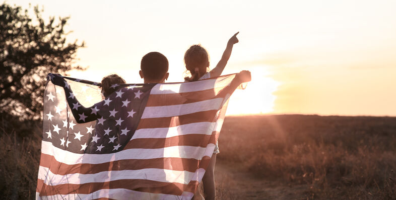 Children holding an American flag