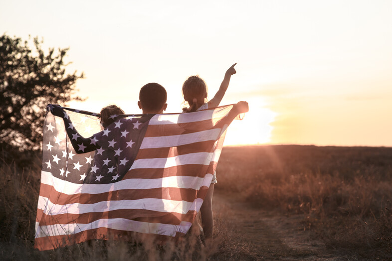 Children holding an American flag