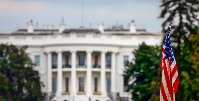 The white house with an American flag out front