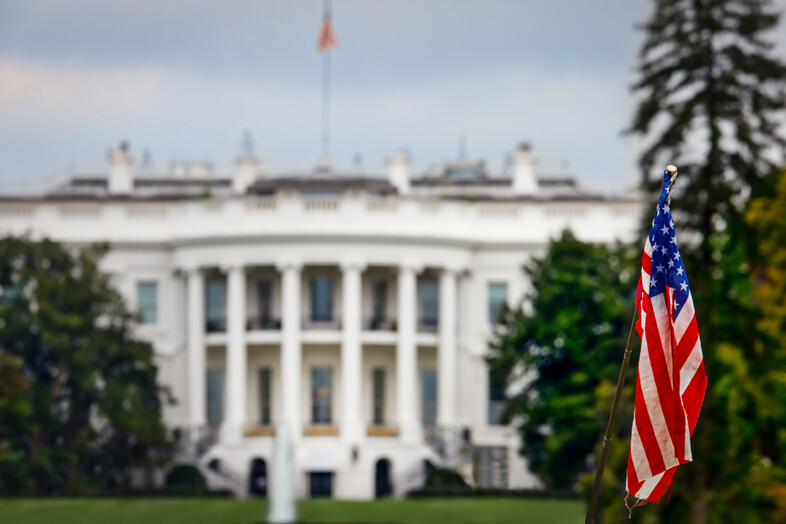 The white house with an American flag out front