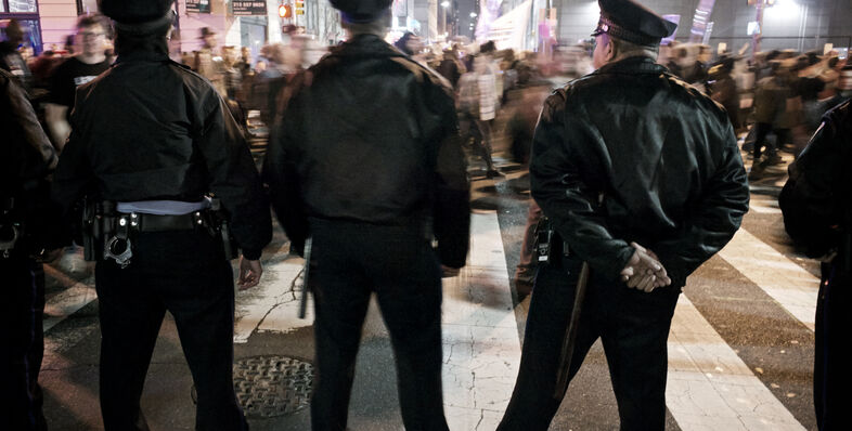 Police standing in front of a protest