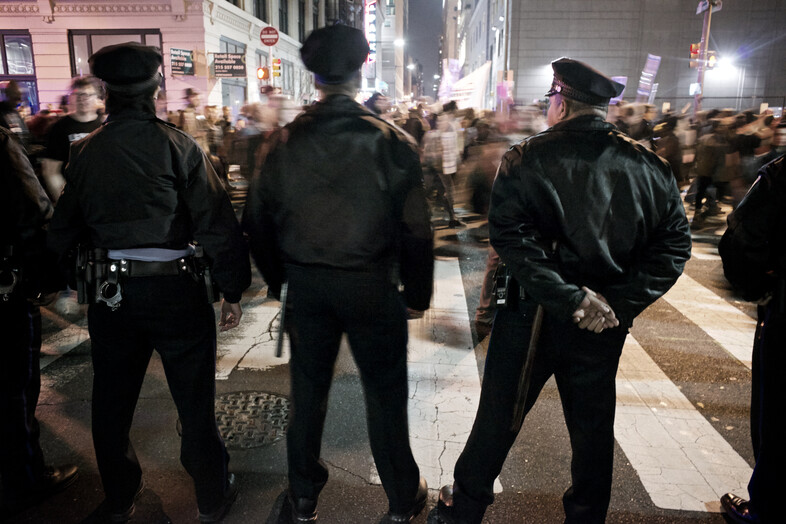 Police standing in front of a protest