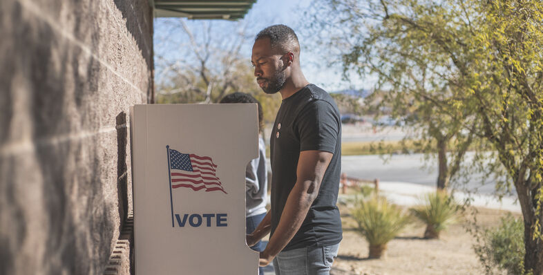 A man voting outdoors