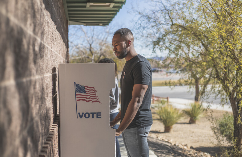 A man voting outdoors